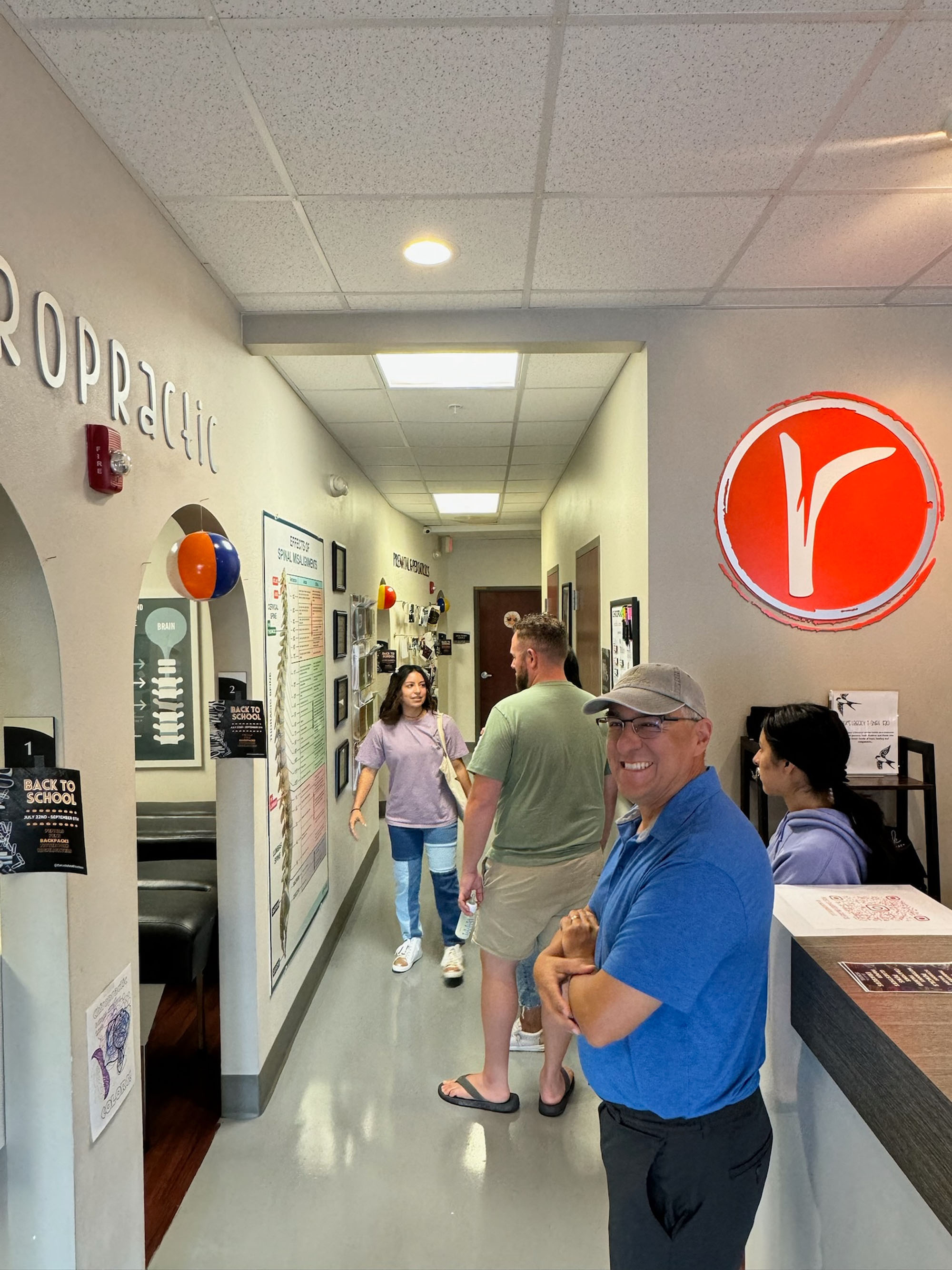 Patients and staff in the reception hallway at The Roots Health Centers.