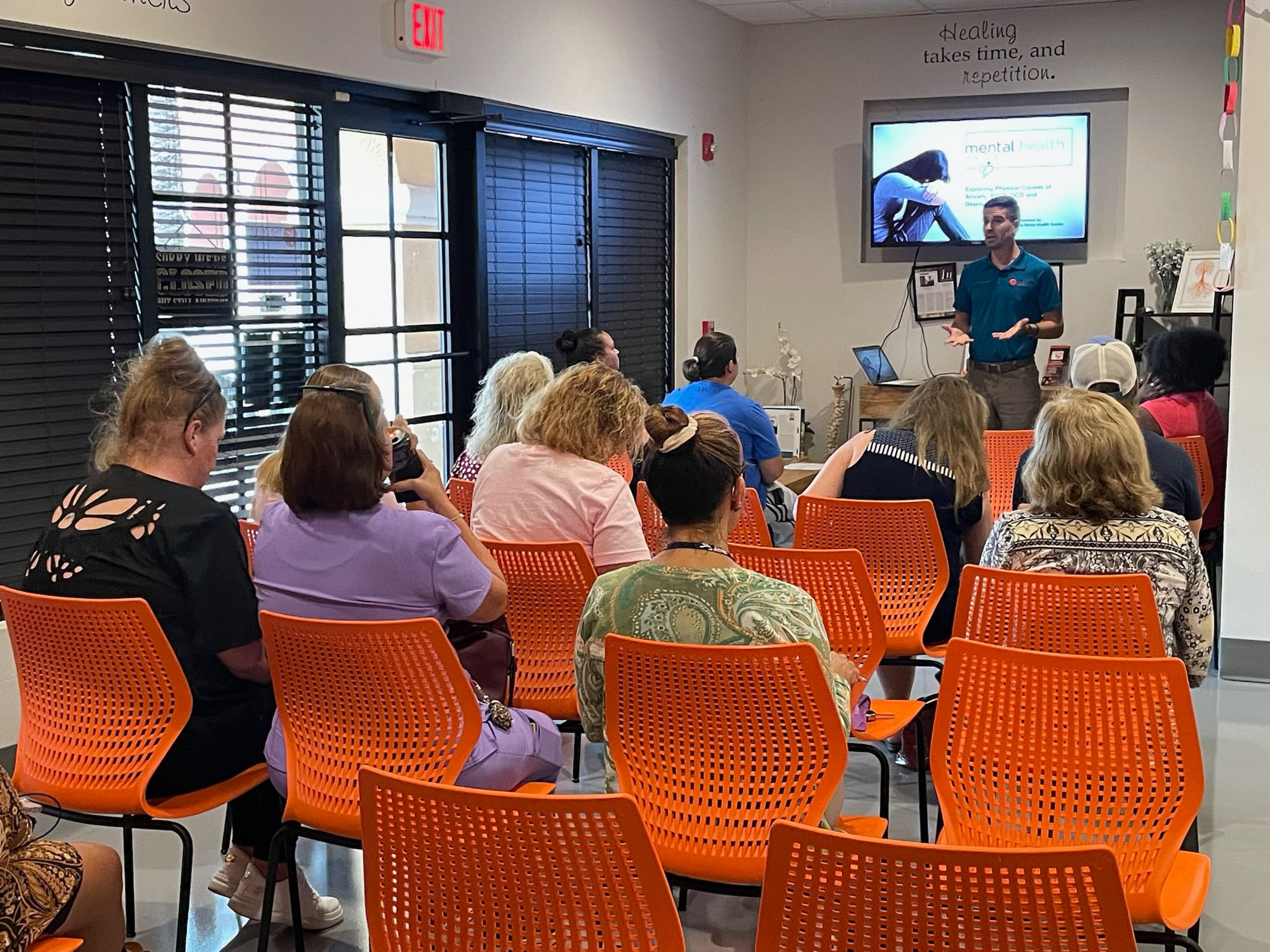 Dr. Logan Swaim presents a nervous-system talk at a Roots seminar.