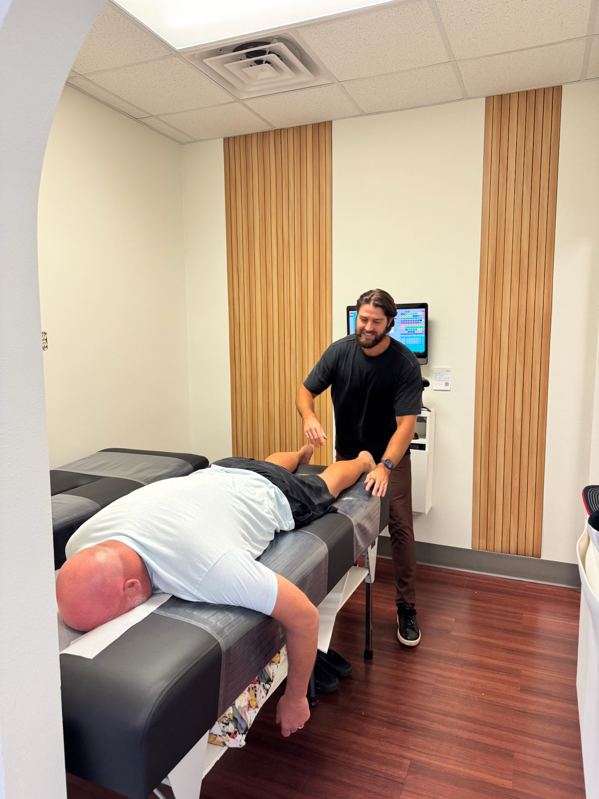 Dr. Logan Swaim delivers a Torque Release adjustment to an adult patient.